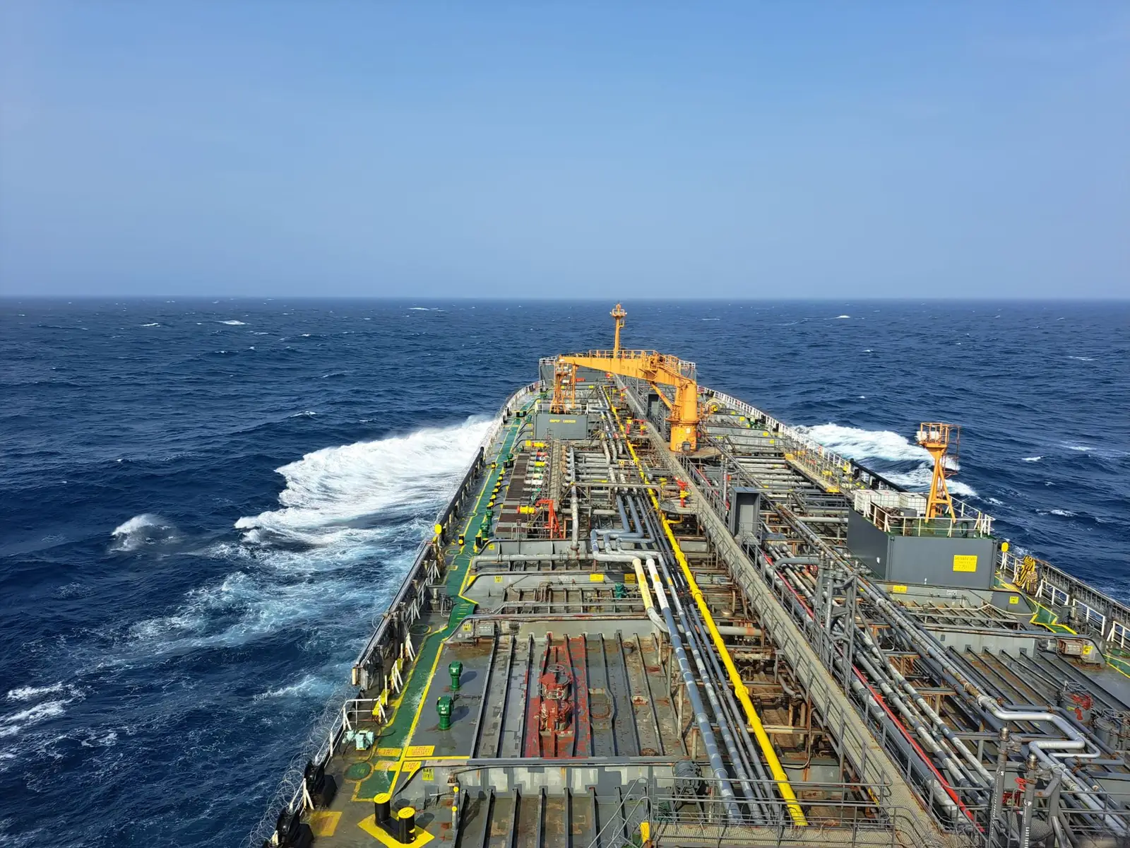 Oil tanker main deck and pipelines at sea